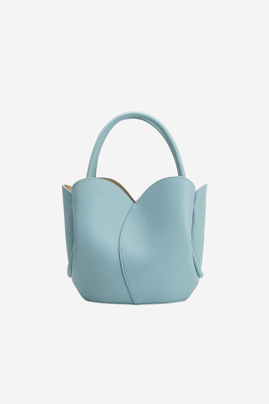 Light blue handbag with a unique design on a white background